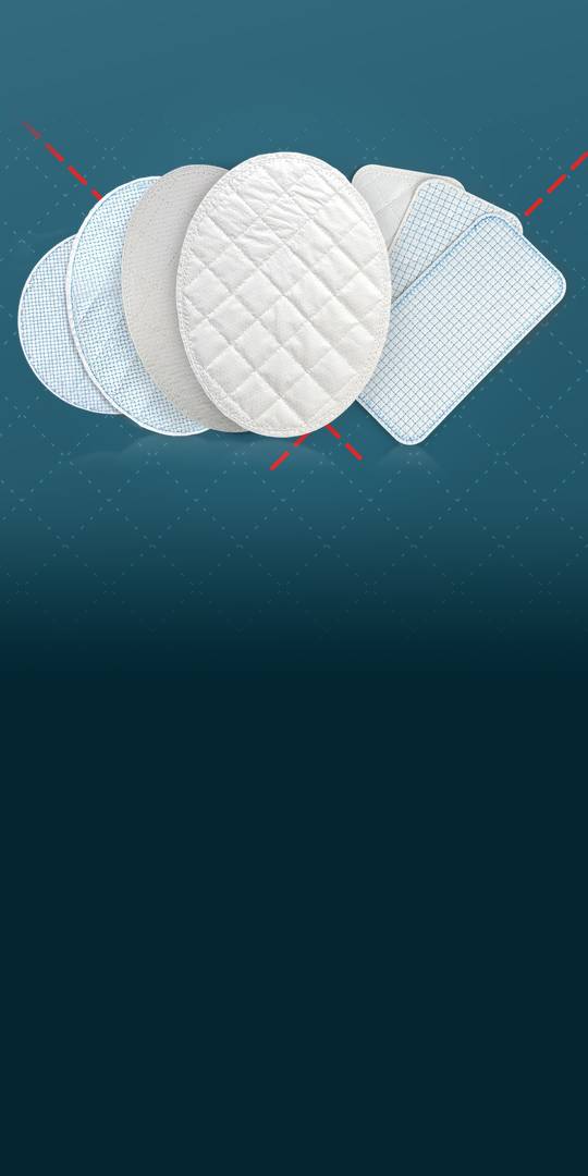 Seven pads of reinforced tissue matrix fanned out, some quilted in a diamond pattern and some stitched with a fine blue grid, on a teal field with a dashed red thread