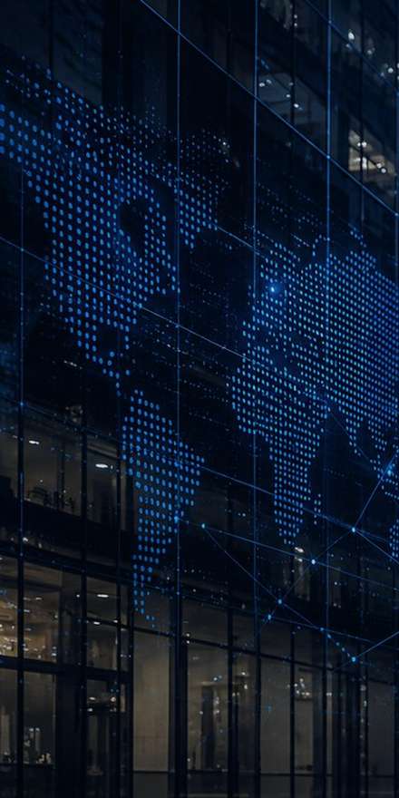 Glass office facade with a dotted world map and network lines